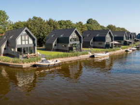 Attractive holiday home in Balk with jetty